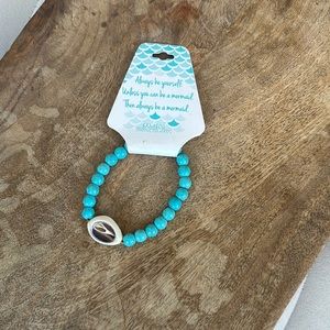 Bamboo Trading Company- Turquoise distressed beaded Shell bracelet (Stretchy)